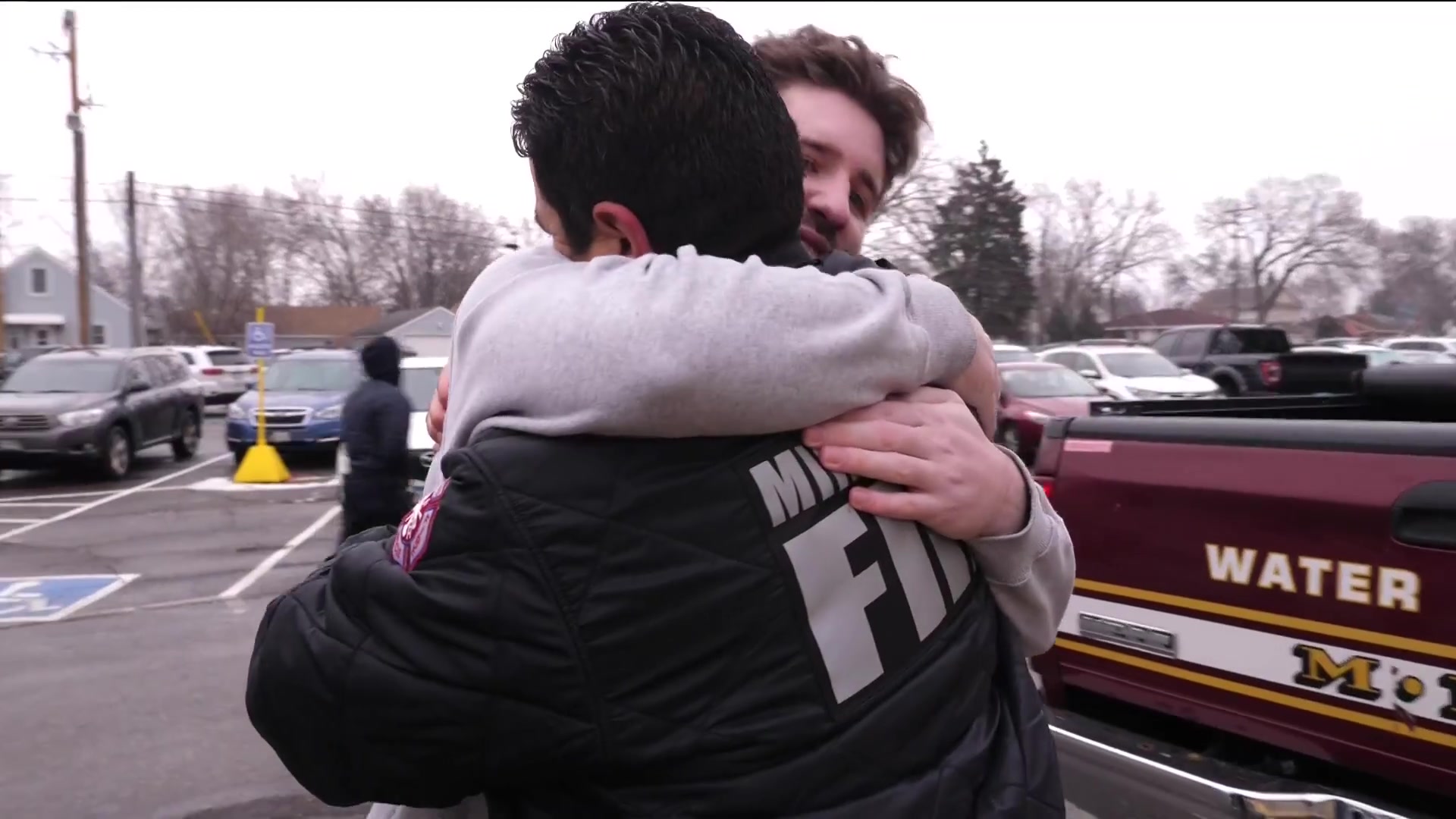 Josh Liljenquist hugging Minneapolis Fire Captain Adam Graves during a KARE 11 Sunrise profile about Operation Warm.