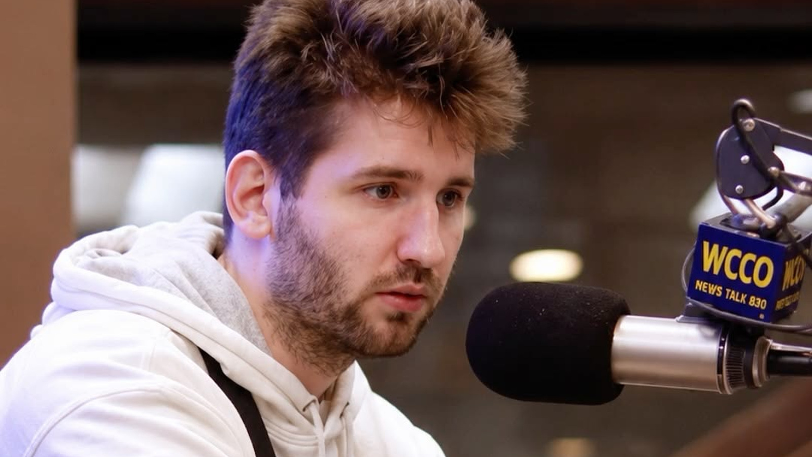 Josh Liljenquist speaks into a WCCO News Talk 830 microphone during an in-studio interview with Jason DeRusha.